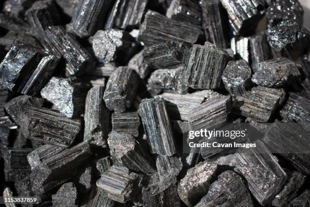 raw crystal of black tourmaline (schorl) gemstone - tourmaline gem stock pictures, royalty-free photos & images