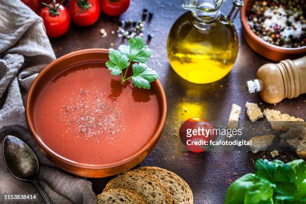 tomato soup with ingredients on rustic wooden table - gazpacho stock pictures, royalty-free photos & images