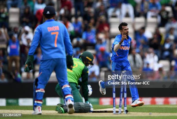 Yuzvendra Chahal of India celebrates after taking the wicket of Rassie Van Der Dussen of South Africa during the Group Stage match of the ICC Cricket...