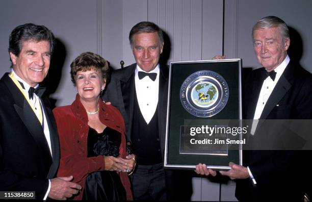 Hugh O'Brian, Lydia Clarke, her husband, Charlton Heston and James Stewart at the Hugh O'Brian Youth Foundation Awards, Beverly Hills, California,...