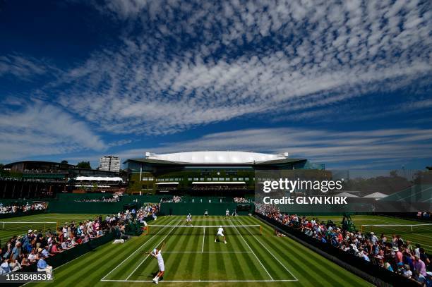 Netherlands's Jean-Julien Rojer and Romania's Horia Tecau play against France's Fabrice Martin and Monaco's Hugo Nys during their men's doubles...