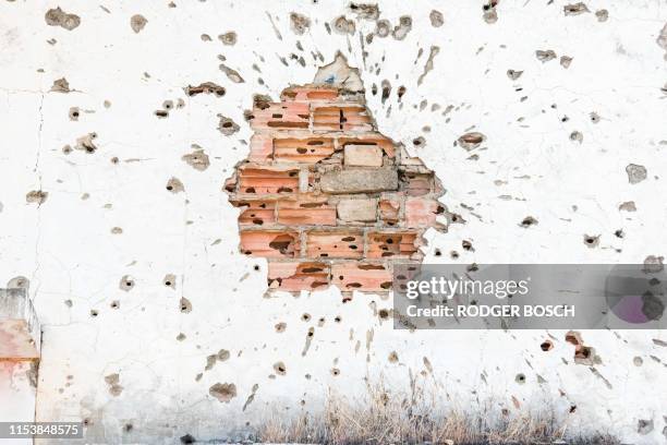 Bullet Riddled Square 714 Bullet Hole Wall Stock Photos, High-Res Pictures, and Images ...