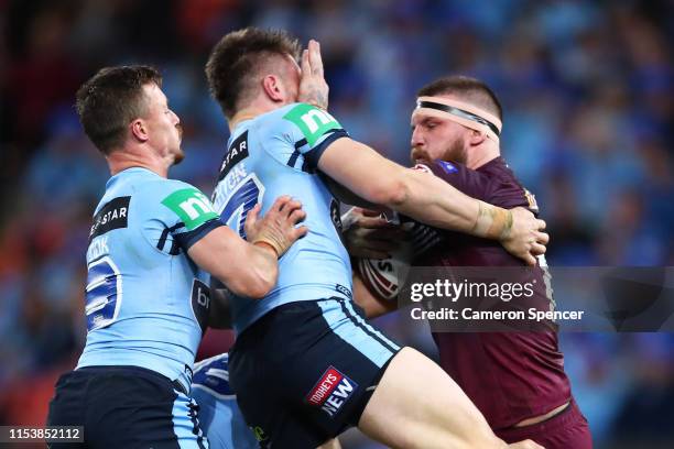 Josh McGuire of the Maroons is tackled during game one of the 2019 State of Origin series between the Queensland Maroons and the New South Wales...