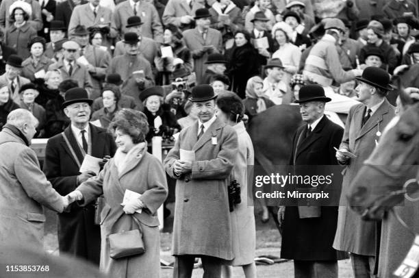 Queen Elizabeth The Queen Mother with Secretary of State for War John Profumo and his wife Valerie Hobson at Sandown Park Racecourse. 22nd March 1963.