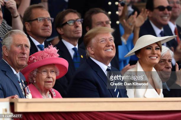 President of the United States, Donald Trump and First Lady of the United States, Melania Trump watch the fly-past next to President of the France,...