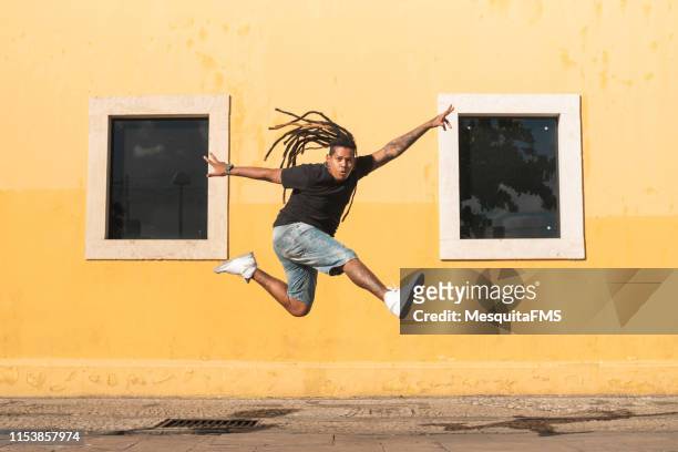 punk person jumping on the street - hip hopper stock pictures, royalty-free photos & images