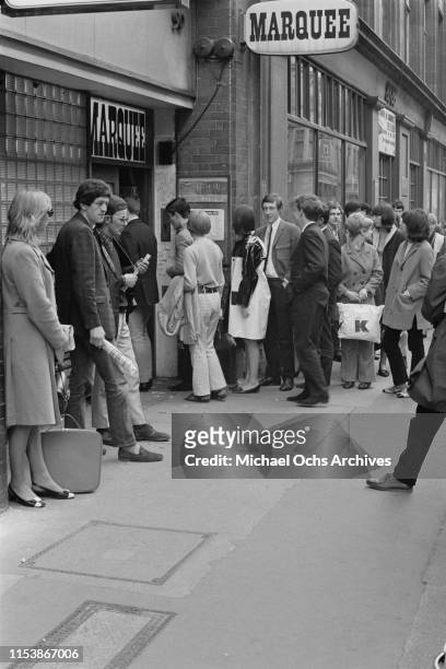 People queuing up outside the Marquee Club to attend the live concert of American rock band The Lovin' Spoonful, London, UK, 18th April 1966.