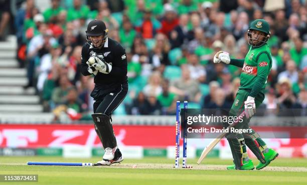 Tom Latham, the New Zealand wicketkeeper runs out Mushfiqur Rahim during the Group Stage match of the ICC Cricket World Cup 2019 between Bangladesh...