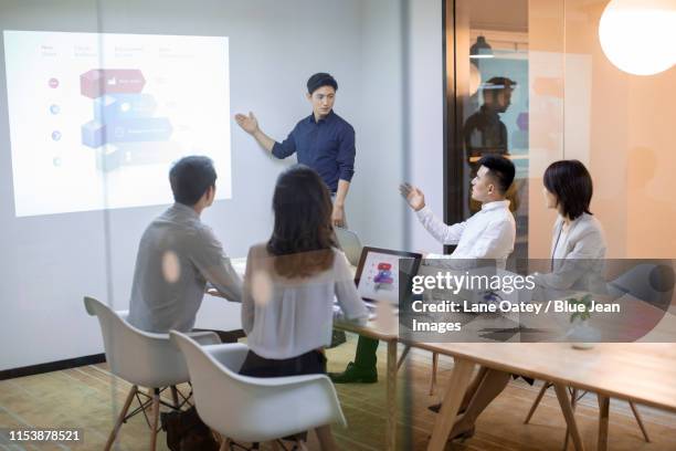 business people having meeting in board room - フォーマルウェア ストックフォトと画像