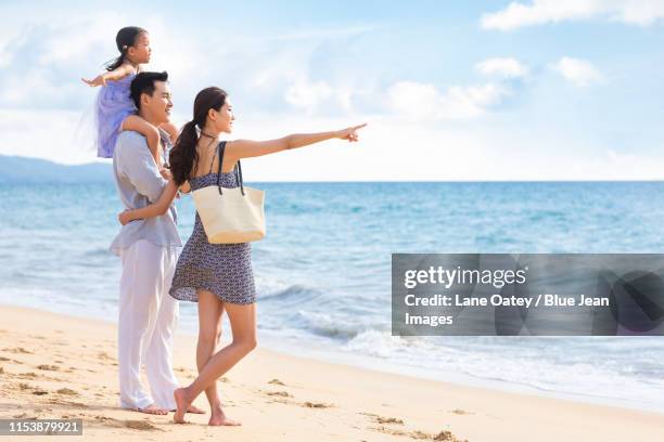 happy young family by the sea - tourist mother father child thailand stock pictures, royalty-free photos & images