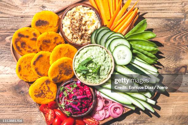 vegan hummus snack platter vertical - body issue celebration party stock pictures, royalty-free photos & images