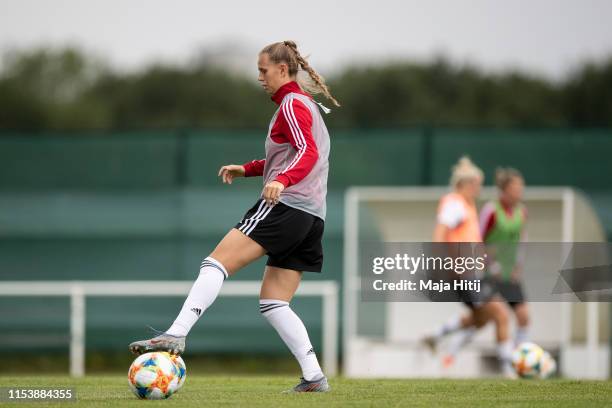 Klara Buehl controls the ball during a training session of the German women's national football team on June 05, 2019 in Bruz, France. Germany will...