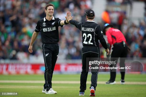 Matt Henry and Kane Williamson of New Zealand celebrate the wicket of Mashrafe Mortaza of Bangladesh during the Group Stage match of the ICC Cricket...