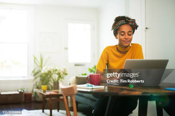 woman using laptop in home - laptop at home stock pictures, royalty-free photos & images