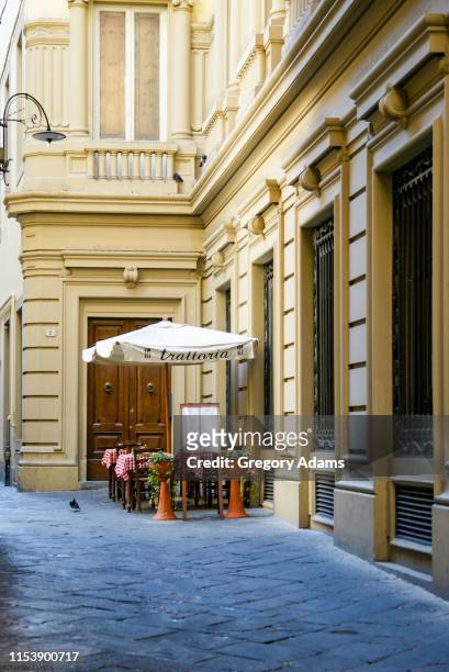 sidewalk cafe in an alley in lucca, italy - lucca italy stock pictures, royalty-free photos & images