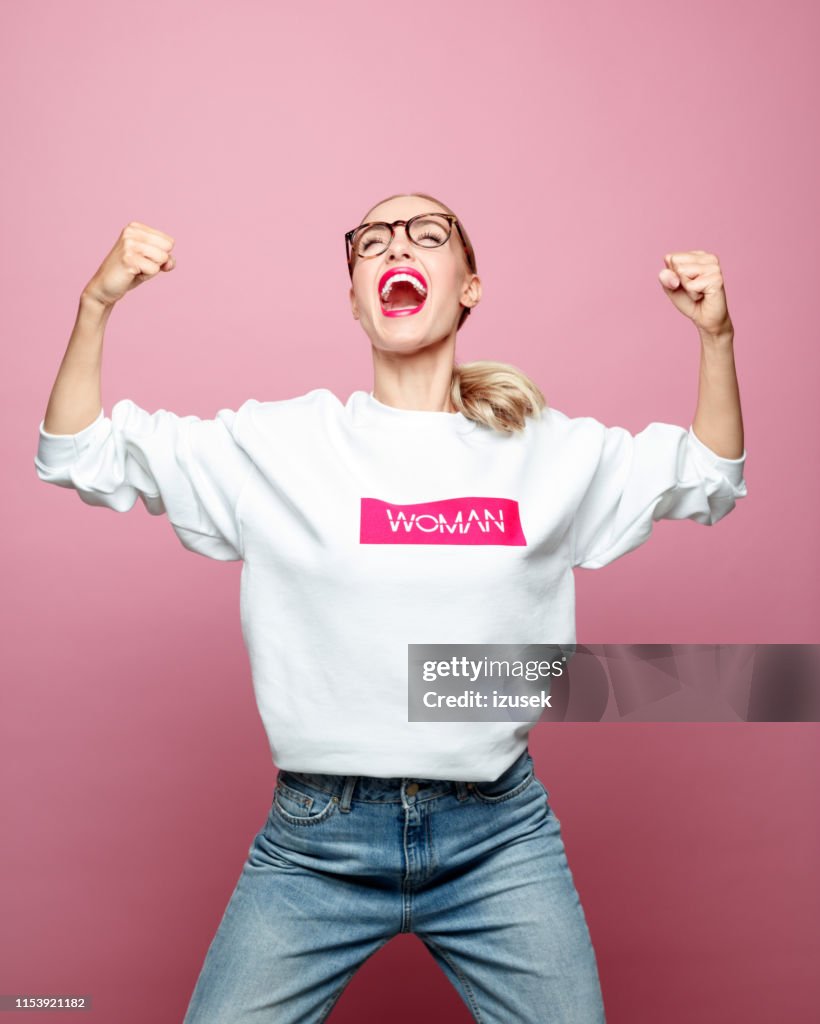 Successful mid adult woman screaming