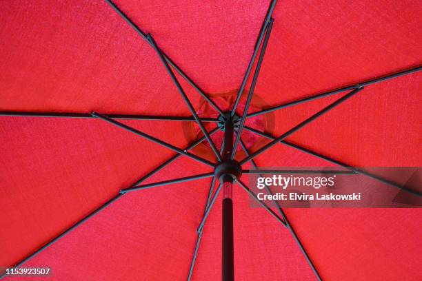 low angle view red parasol - red parasol stock pictures, royalty-free photos & images