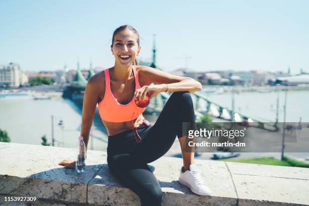 sportswoman jogging in the city - sportswear stock pictures, royalty-free photos & images