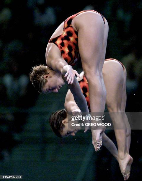 Anne Montminy and Emilie Heymans of Canada execute an open pike in tandem in the women's synchronized 10m platform final of the diving competition 28...