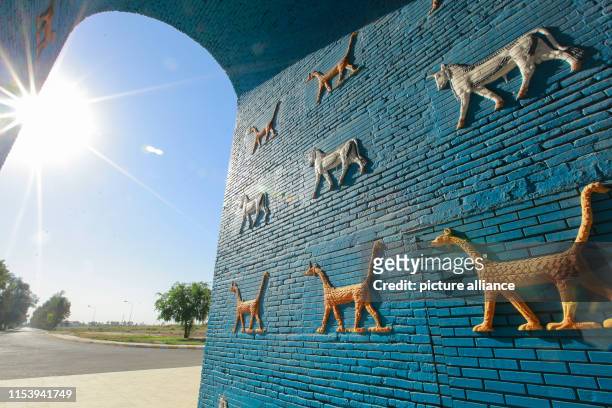 Dpatop - 05 July 2019, Iraq, Hillah: A general view of a replica of Ishtar Gate at the site of Babylon, a kingdom in ancient Mesopotamia, now located...