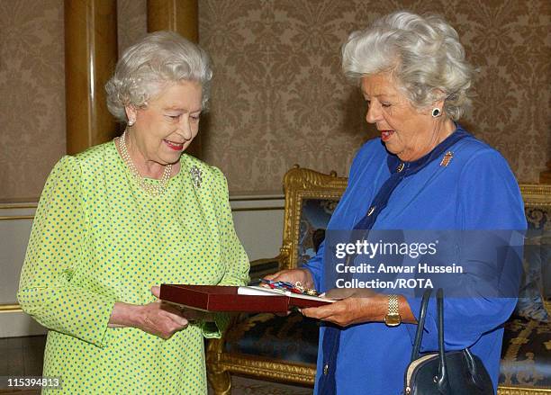 The Queen Elizabeth II presents Baroness Boothroyd with the Insignia of the Order of Merit, a personal award from the Queen recognizing exceptional...