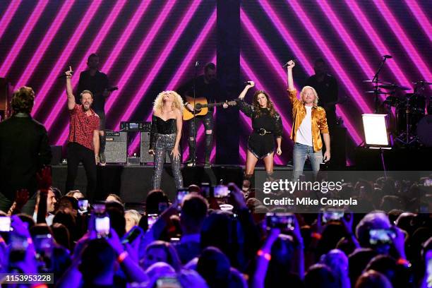 Jimi Westbrook, Kimberly Schlapman, Karen Fairchild and Phillip Sweet of musical group Little Big Town perform at the 2019 CMT Music Awards at...