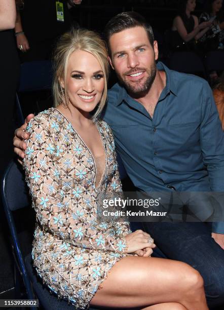 Carrie Underwood and Mike Fisher attend the 2019 CMT Music Award at Bridgestone Arena on June 05, 2019 in Nashville, Tennessee.
