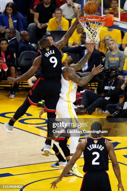 Serge Ibaka of the Toronto Raptors attempts to block a shot from DeMarcus Cousins of the Golden State Warriors in the first half during Game Three of...