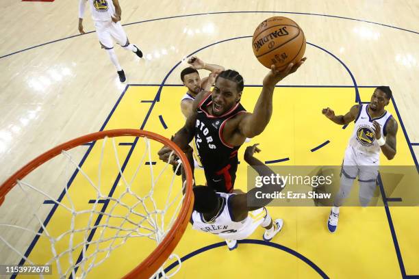 Kawhi Leonard of the Toronto Raptors attempts a shot against the Golden State Warriors during Game Three of the 2019 NBA Finals at ORACLE Arena on...