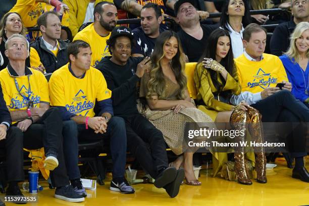 Jay-Z and Beyonce attend Game Three of the 2019 NBA Finals between the Golden State Warriors and the Toronto Raptors at ORACLE Arena on June 05, 2019...