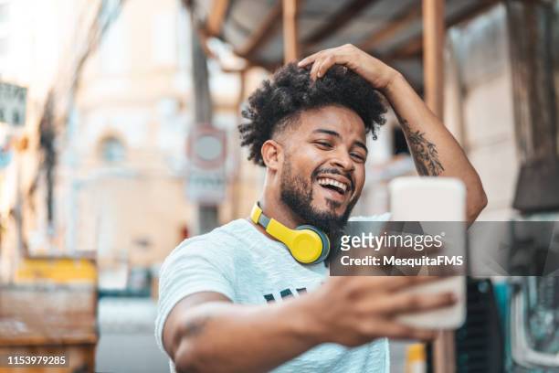 Young man taking selfie on the street