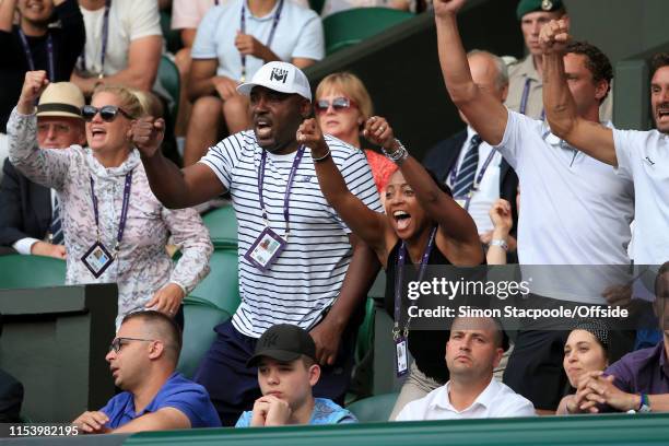 Corey Gauff and Candi Gauff , parents of Cori Gauff , celebrate as she wins a point during her Ladies' Singles 3rd Round match against Polona Hercog...