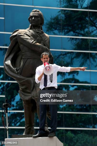 Opposition leader and president of the National Assembly Juan Guaido speaks to supporters during a demonstration at PNUD as part of the 208th...