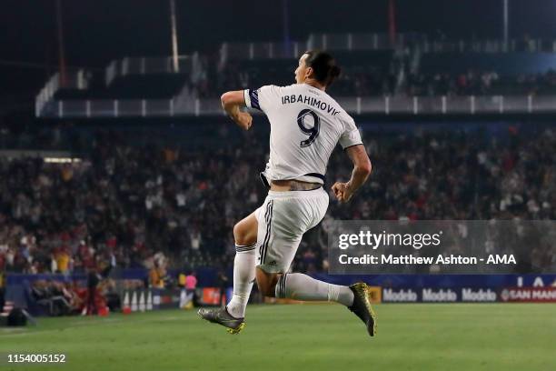 Zlatan Ibrahimovic of LA Galaxy celebrates after scoring a goal to make it 2-0 whilst wearing a shirt in the second half with his name spelt...