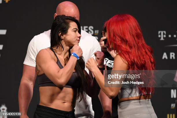 Claudia Gadelha of Brazil and Randa Markos of Canada face off during the UFC 235 weigh-in at T-Mobile Arena on July 5, 2019 in Las Vegas, Nevada.