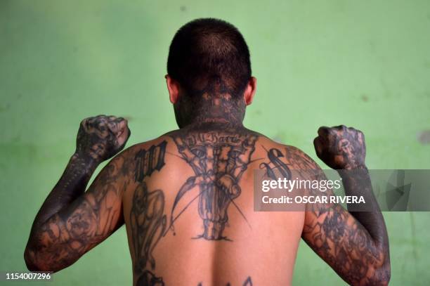 An ex member of the MS-13 gang is pictured at Santa Ana prison, 60 km northwest of San Salvador, on May 21, 2019. - Former members of Salvadoran...