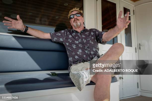 Millionaire John McAfee gestures during an interview with AFP on his yacht anchored at the Marina Hemingway in Havana, on June 26, 2019. - After...