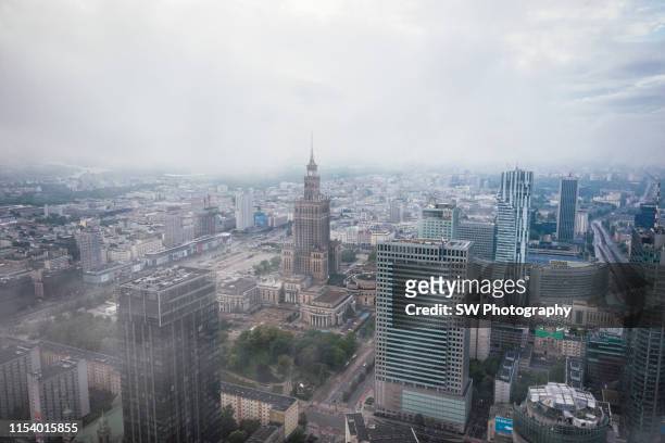 palace of culture and science in the cloud - warsaw aerial stock pictures, royalty-free photos & images