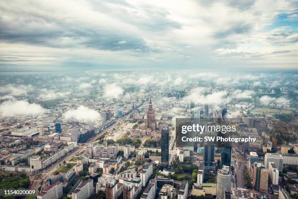 palace of culture and science in the cloud - warsaw city stock pictures, royalty-free photos & images