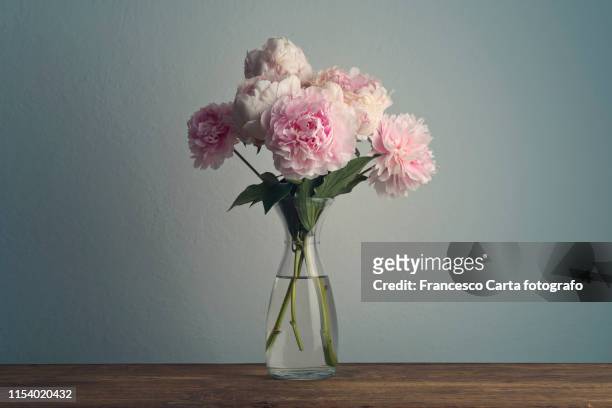 bouquet of peonies in vase - peony bouquet stock pictures, royalty-free photos & images