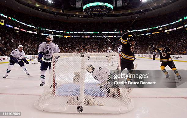 Rich Peverley of the Boston Bruins celebrates after Mark Recchi scored a goal in the second period against Roberto Luongo of the Vancouver Canucks...