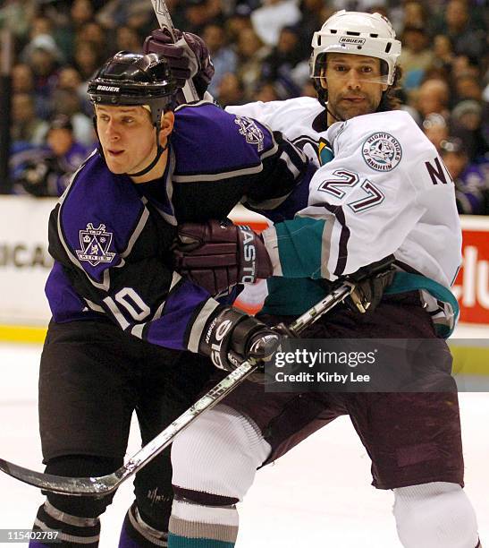 Scott Niedemayer of the Mighty Ducks of Anaheim grabs Nathan Dempsey of the Los Angeles Kings. The Kings defeated the Ducks, 3-2, in overtime...