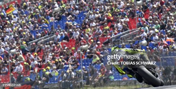 Monster Energy Yamaha's Italian rider Valentino Rossi rides during the qualifying session ahead of the Moto GP Grand Prix Germany at the Sachsenring...