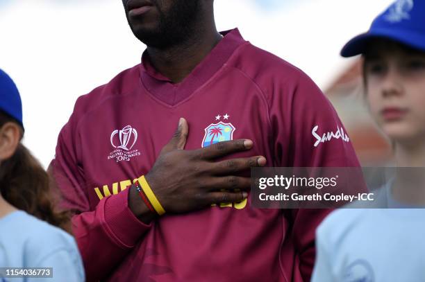 Detailed view of a West Indies badge being held during the national anthems during the Group Stage match of the ICC Cricket World Cup 2019 between...