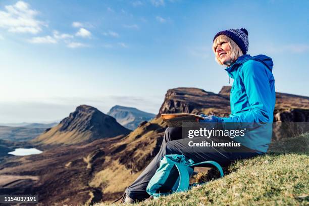 hiking the quiraing trail, isle of skye, scotland - scotland map stock pictures, royalty-free photos & images