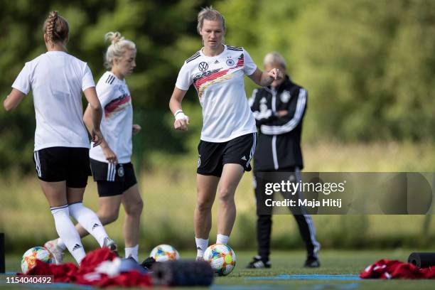 Alexandra Popp of Germany controls the ball during a training session of the German women's national football teamon June 06, 2019 in Bruz, France.