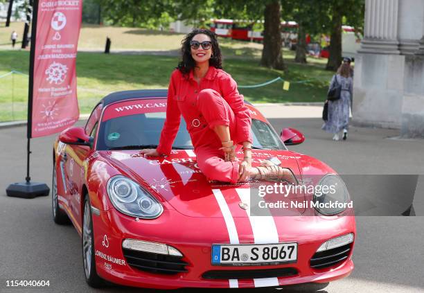 Lily Becker takes part in a photocall at the launch of the Cash & Rocket Charity Tour at Wellington Arch on June 06, 2019 in London, England.