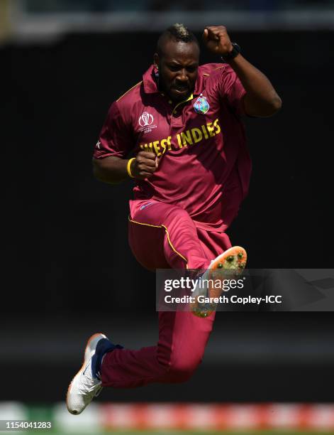 Andre Russell of West Indies celebrates after taking the wicket of Usman Khawaja of Australia during the Group Stage match of the ICC Cricket World...