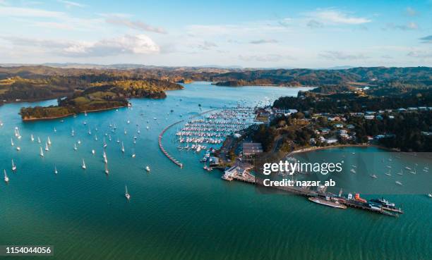 overlooking bay of islands, with ferry terminal to new zealand. - russell imagens e fotografias de stock