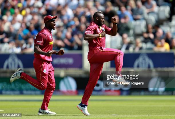Andre Russell of the West Indies celebrates after taking the wicket of Usman Khawaja during the Group Stage match of the ICC Cricket World Cup 2019...